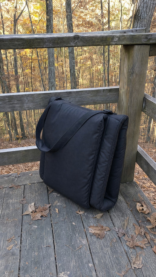HuddleWarm folded flat with carry strap